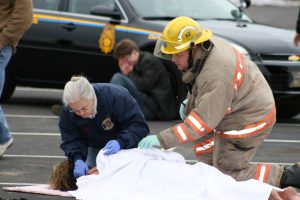 A mock car crash feels very real when high school students play the parts of intoxicated driver and critically injured prom date. 