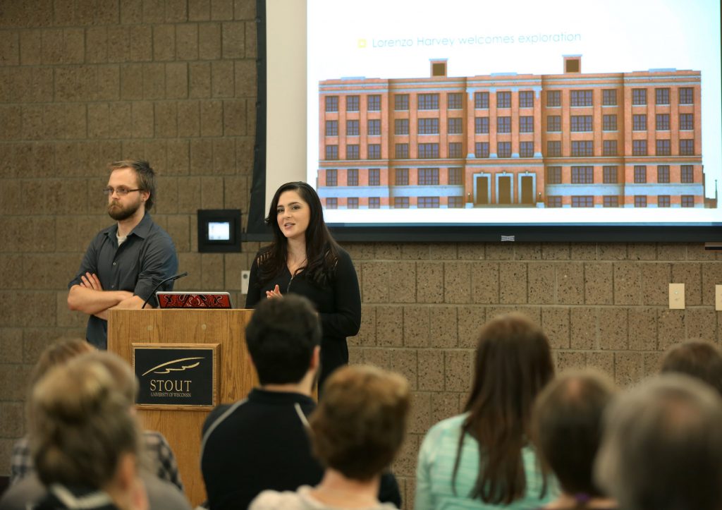 From left, students Ian Pommer and Marisa Malahowski discuss the Harvey Hall digital humanities project at UW-Stout.