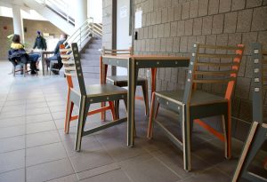 A new social area in the Micheels Hall atrium features furniture designed by student David Hillenbrand.