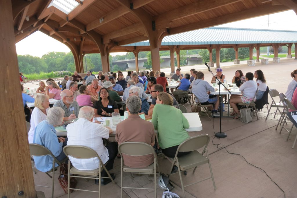 Local residents discuss the effects of racism in the Chippewa Valley during a recent program at Phoenix Park in Eau Claire.