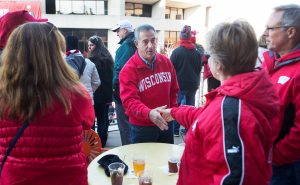 Former U.S. Sen. Russ Feingold works the crowd before the start of the Badger football game on Oct. 17, 2015. Stadium. 