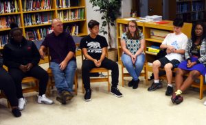 UW-Stout instructor James Handley, second from left, speaks about activism and nonviolence in September with a small group of Milwaukee School of Languages students
