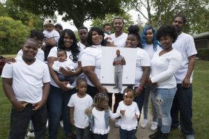 Beverly Walker, center, is surrounded by the family she shares with her husband, Baron, pictured at center. Baron Walker has been incarcerated for some 22 years for armed robbery and eligible for parole since 2011. The Walkers were featured in "Milwaukee 53206", a 2016 documentary about the effects of imprisonment on black families. (Photo courtesy of Noel Spirandelli) 